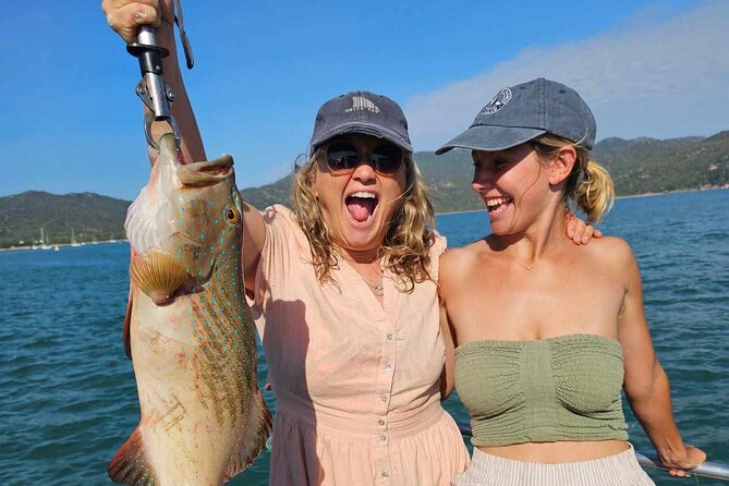 4H Snorkeling and Fishing Cruise on Magnetic Island - Arthur Bay: reef, coastline, and a second chance in the water