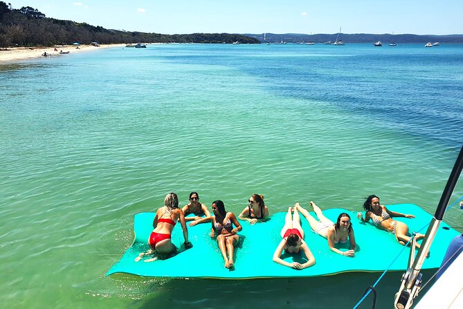 Afternoon Moreton Bay Sailing Tour - A swim stop with an aqua mat and paddleboards
