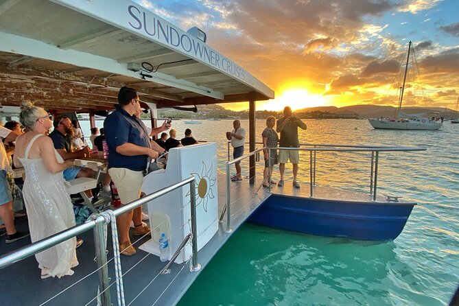 Airlie Beach Sunset Cruise - Pioneer Bay, waterfront homes, and the first sunset colors