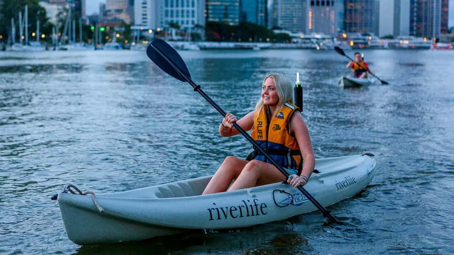 Brisbane: Illuminated River Night Kayak Tour - Getting ready for a single kayak