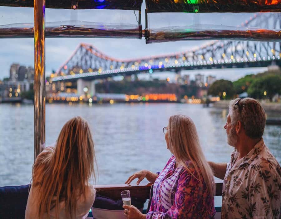 Brisbane: Sunset City Lights Cruise 5.30pm or 6pm <em>seasonal – Key points at a glance’ /></p>
<ul>
<li><strong>Two seasonal departure times:</strong> Leave at 5:30pm from April through September, or 6pm from October through March.</li>
<li><strong>Story Bridge and Kangaroo Cliffs:</strong> The route gives you strong river views of two of Brisbane’s best-known sights.</li>
<li><strong>A snack board is included:</strong> A complimentary charcuterie share board arrives during the cruise.</li>
<li><strong>Drinks cost extra:</strong> The onboard bar sells drinks and snacks, but you cannot bring your own food or drinks.</li>
<li><strong>Quiet, relaxed atmosphere:</strong> Background music replaces a tour guide, making this better for unwinding than learning facts.</li>
<li><strong>South Bank meeting point:</strong> Board at the Cultural Centre Public Pontoon, in front of the cultural centre.</li>
</ul>
<h2>Why Brisbane looks different from the river at dusk</h2>
<p><img width="900" height="675" decoding="async" src=