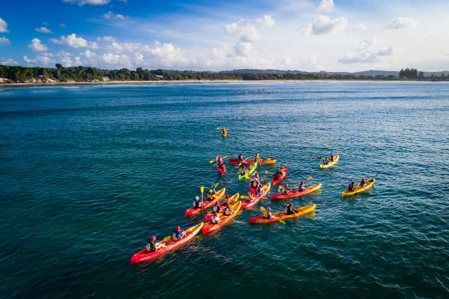 Byron Bay: The Byron Bay Sea Kayak Tour - Catching a wave back to shore