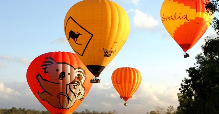 Cairns: Hot Air Balloon Flight with Transfers - Landing, balloon pack-up, and the post-flight toast