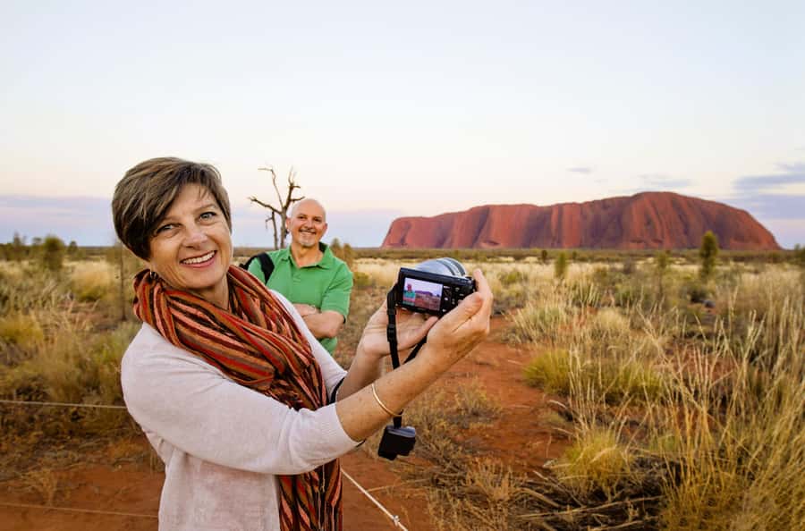 From Alice Springs/Yulara: 2 Day Uluru Kata Tjuta Rock Tour - Sunset turns Uluru into a moving picture