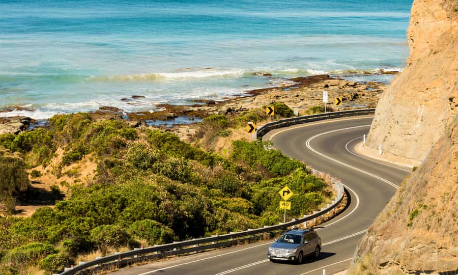 From Melbourne: Great Ocean Road Full-Day Sunset Tour - The Memorial Arch and the story of the road