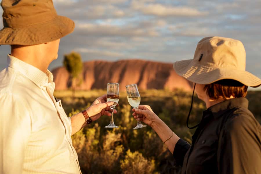 From Yulara: Uluru Tour and Sunset BBQ - Following the Mala Walk past rock art