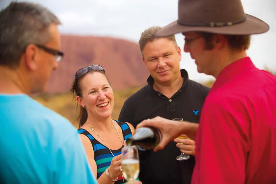 Uluru 1.5-Hour Sunset Tour with Sparkling Wine & Cheeseboard - The first sight of Uluru from the coach